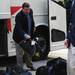 Michigan head coach Brady Hoke helps unload bags from under the bus as the football team arrives at Memorial Stadium in Lincoln, Nebraska on Saturday. Melanie Maxwell I AnnArbor.com
